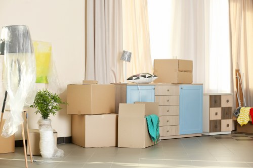 Flat clearance professionals working in a Byfleet flat