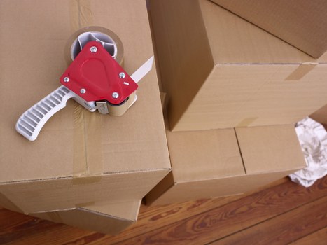 Efficient flat clearance workers removing items from a flat